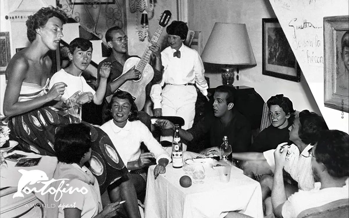 Friends enjoy drinks, music, autographed walls - portofino - 1960 © carrier