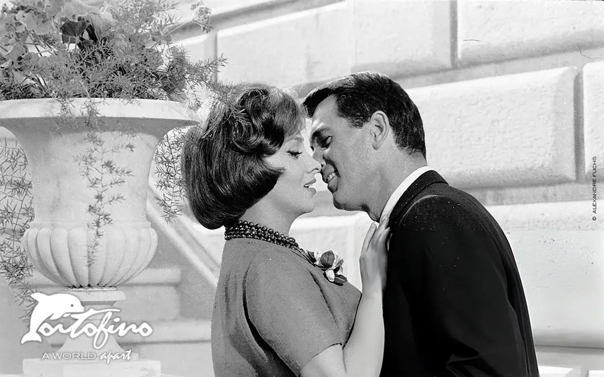 Rock Hudson kissing actress Gina Lollobrigida in a scene of the movie Come September in 1960 at Portofino