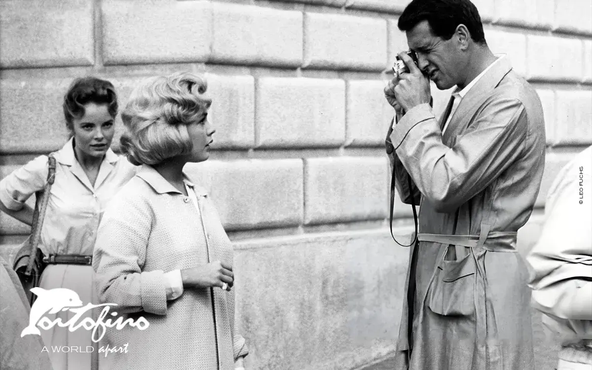 Rock Hudson takes the picture of actress Sandra Dee for a scene of the film 'Come September', at Portofino, Italy, in 1960