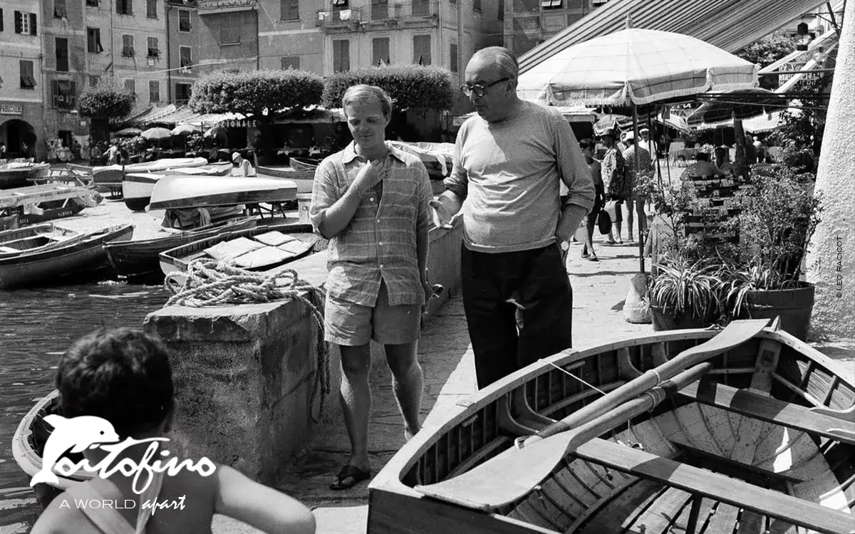 Truman Capote walking the docks of Portofino with fellow writer, Orio Vergani, 1953 Leo Racicot